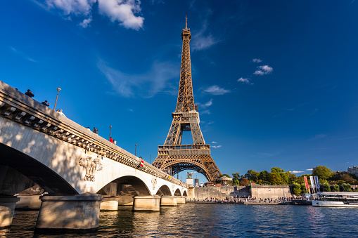Paris, France - September 17, 2022:  Eiffel Tower by the Seine River in Paris at summer. France