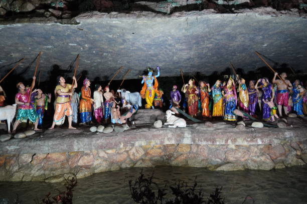 istock krishna lifted mountain on his finger scene statue 1474350250