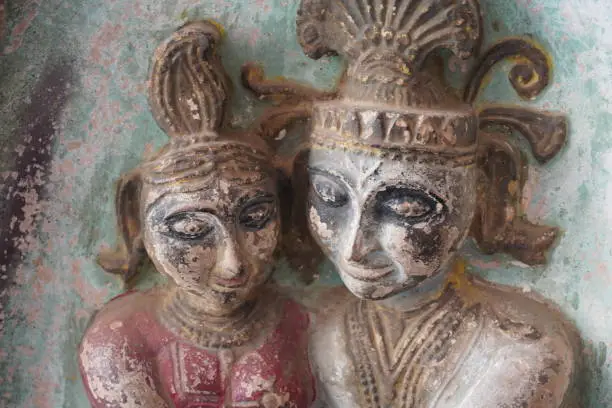 Photo of very ancient two statue in a temple image