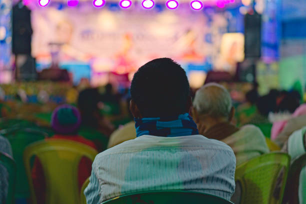 istock an indian person watching stage performance 1474352339