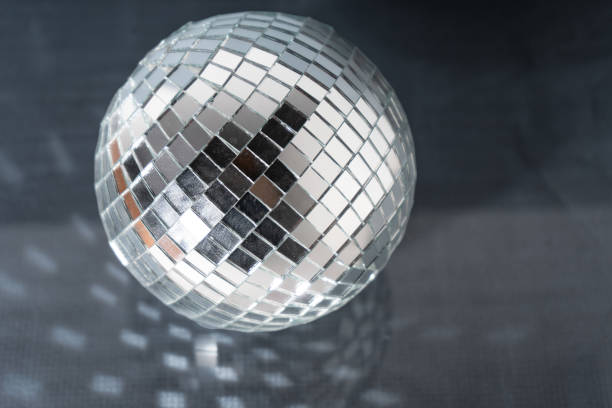 istock Mirror disco ball on black background. Brilliant decoration, silver decor. 1474352777