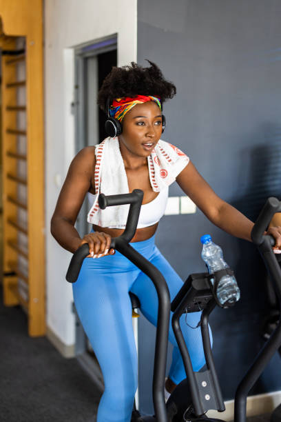 istock A young African female athlete is doing a workout in a gym using an exercise bike. 1474353031