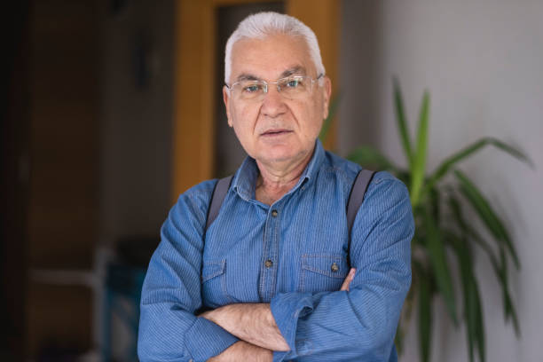 istock Portrait of handsome senior man 1474353237