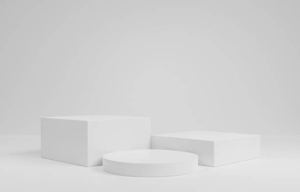 istock empty white podium.3D display podium on white background.Stand Minimal mockup for presentation.Abstract white background concept.Geometric platform show cosmetic product.Stage showcase.3D rendering 1474354222