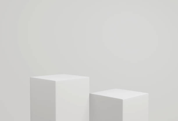 istock empty white podium.3D display podium on white background.Stand Minimal mockup for presentation.Abstract white background concept.Geometric platform show cosmetic product.Stage showcase.3D rendering 1474354265