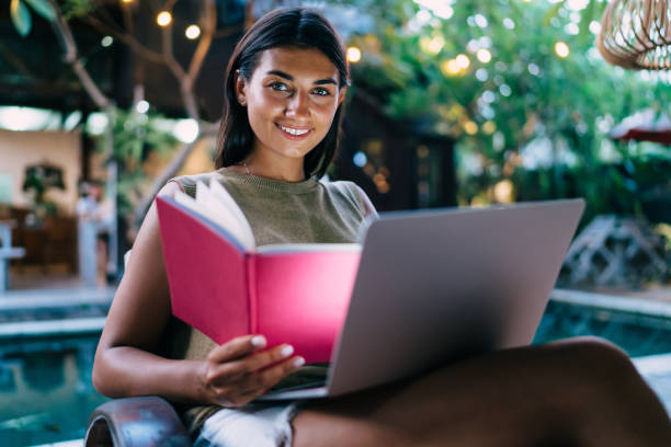 istock Content young lady studying with netbook and laptop 1474354578