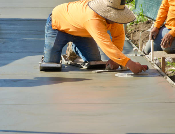istock Construction workers putting finishing touch on the freshly poured concrete 1474354654