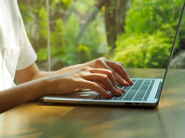 istock Human hand typing on laptop 1474354660