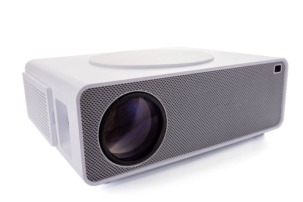 istock White multimedia projector isolated on white background. Video home theater 1474360251