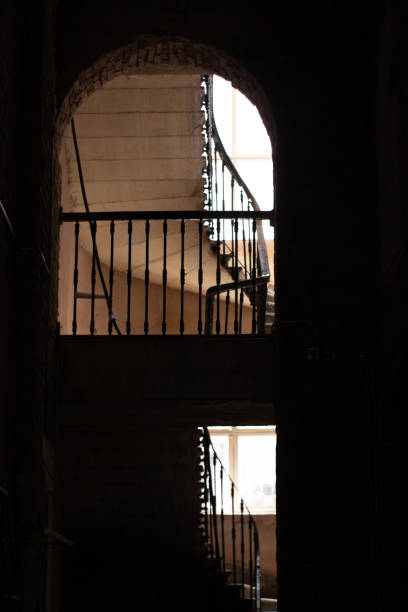 istock a dark interior, stairs and window, stair railings 1474361573