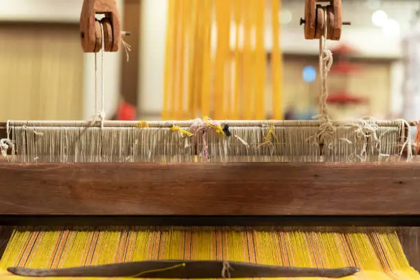 Photo of loom that prepared fibers for weaving work in ancient times weaved with natural fibers and is handicraft that is popular with people because weaving from natural fibers takes quite long time to weave.