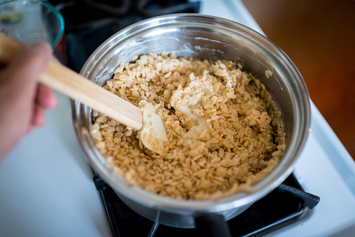 Making rice crispy treats - melting pot full of marshmellows