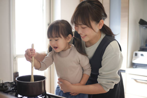 istock parent and child cooking 1474364062