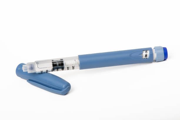 istock Open Blue Insulin Injection Pen with a Needle on White Background - Essential Medical Device for Diabetes Care 1474368064