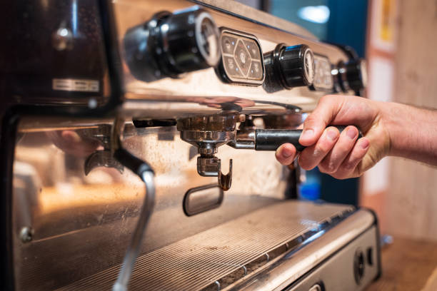 istock Hand in the coffee machine of a bar 1474369360