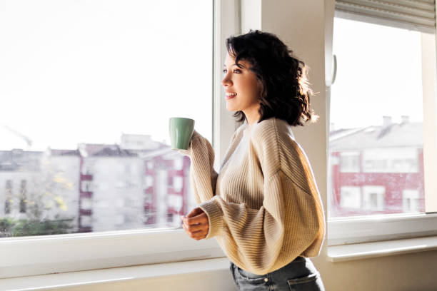 istock Woman at home drinking coffee 1474369420