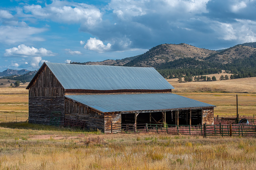 An old weathered barn from a former ranch is aging beautifully in the Front Range of the Colorado Rocky Mountains.