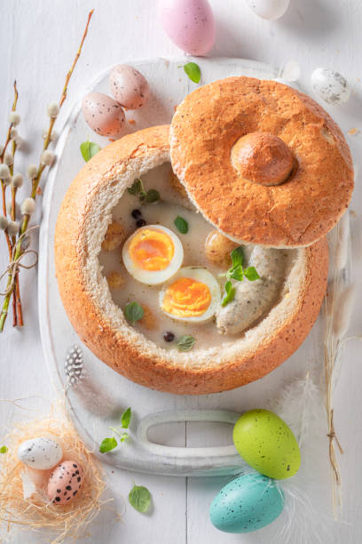 istock Aromatic sour soup with eggs, potato and sausage. 1474373358