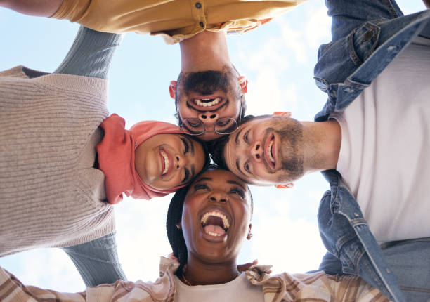istock Support, huddle or happy students in university, educational community or college for future success. Diversity, low angle or funny school friends planning a social group meeting, mission or vision 1474378394
