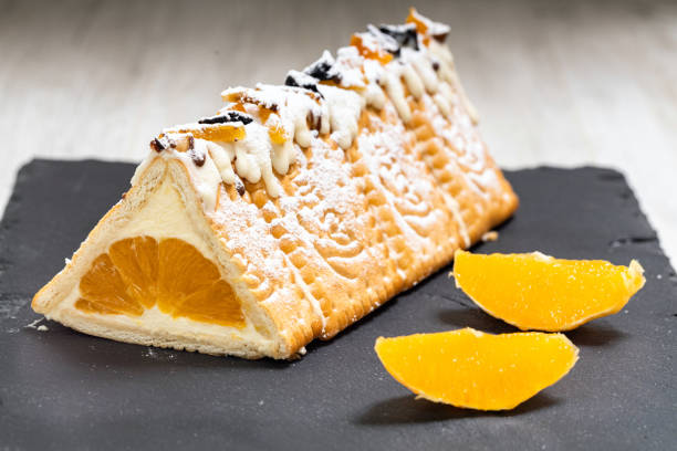 Orange cake with biscuits and orange slices. stock photo