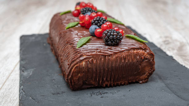 Chocolate and fruit roll cake. Homemade cake stock photo
