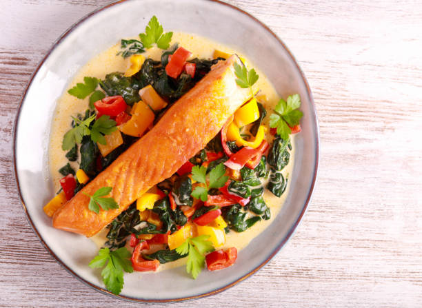 istock Grilled salmon fillet with creamy spinach 1474380747