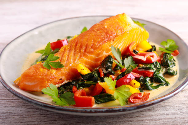 istock Grilled salmon fillet with creamy spinach 1474380810