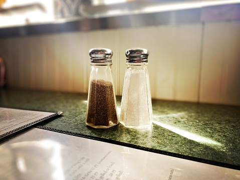 Salt and Pepper Shaker on a Diner Table