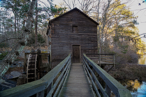 View from wooden walkway up to an abandoned watermill in Stone Mountain, Georgia