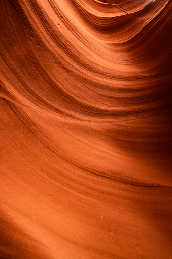 Abstract smoothed out sandstone walls of a slot canyon