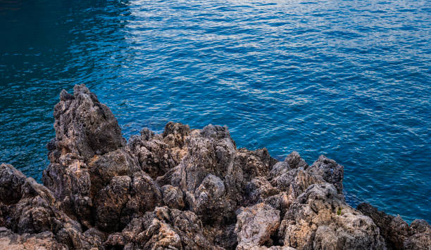 Nature's raw beauty showcased in stunning ocean and rock formation.