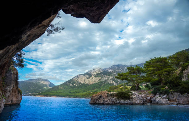 mountain forest and sea view seen from inside the cave