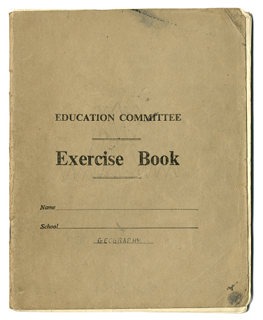 An old exercise book owned by a schoolchild in the mid-20th century; it has been used for Geography. (All identifying details removed.)