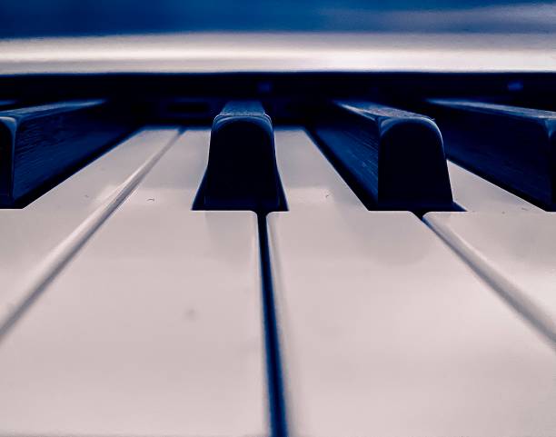 white semi acoustic upright piano close up