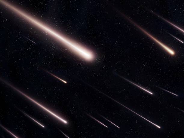 istock Starfall in the night sky. Bright meteorites on a black background. 1474389792