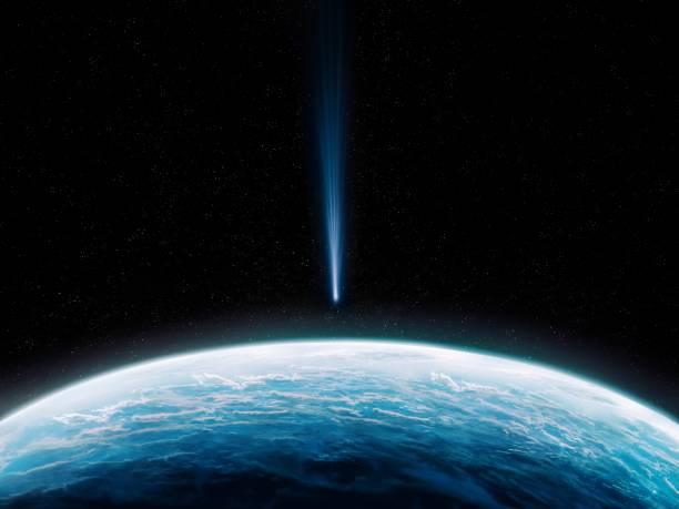 istock Comet is approaching the Earth. Close-up of blue planet with meteorite. 1474389875