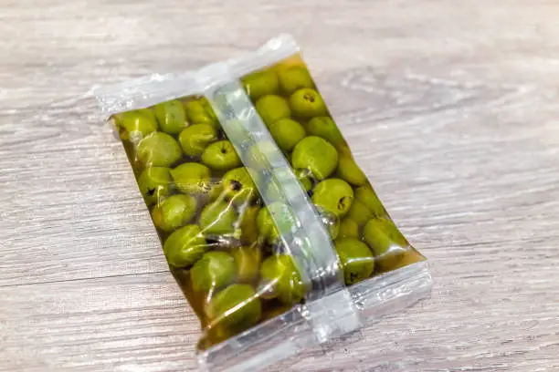 Castelvetrano Sicilian green olives in brine product packaging closeup with sweet variety of fruit from Italy