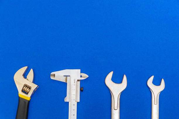 istock Necessary set of tools for plumbers on blue background with space for advertising 1474392482