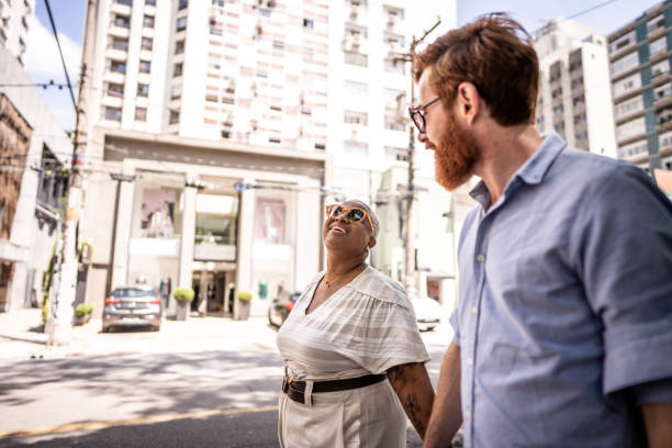 istock Mature couple walking while talk in the city 1474395842
