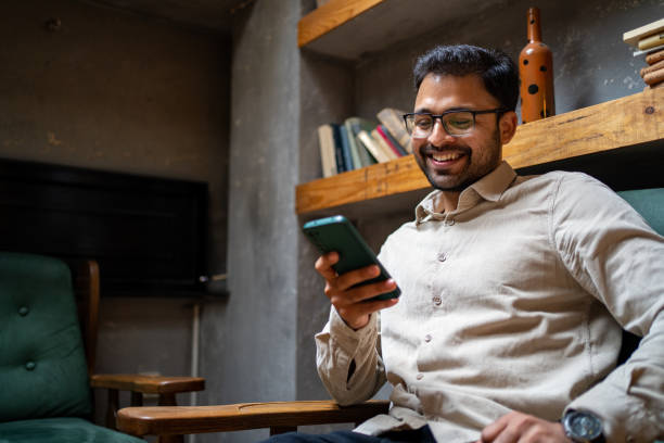 istock Young man shopping online at cafe 1474396180