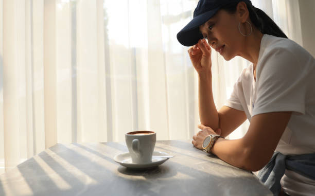 Asia woman with hot coffee refreshment during work outside ,Simple workspace or coffee break in morning/ selective focus