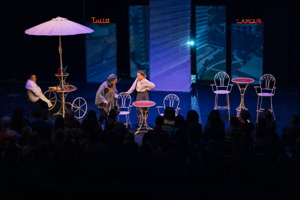 istock Wide view of a theater scene where three actors perform a play 1474397672