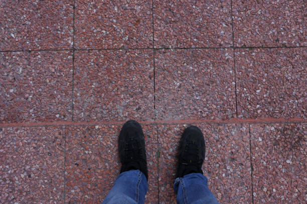 istock Feet standing on the ground 1474400291