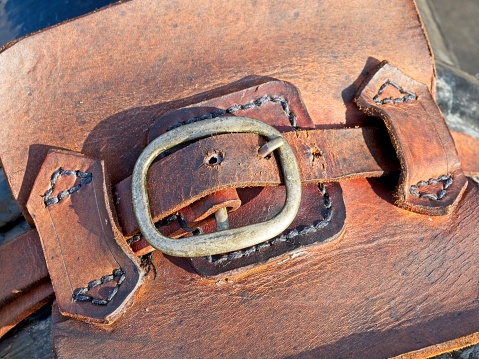 Old weathered leather and buckle at cannon display at Castillo de San Marcos.