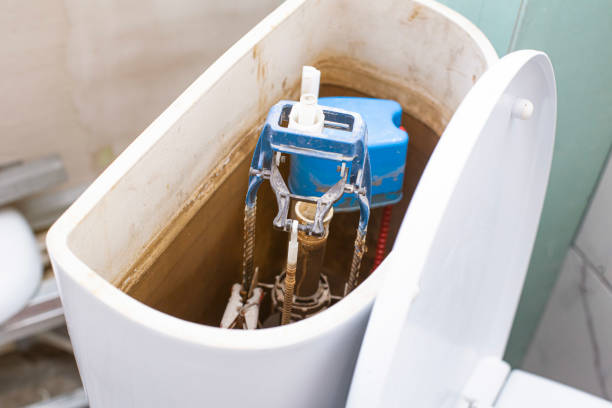 istock open toilet cistern when flush system breaks down, dirty poorly paid plumbing job 1474402538