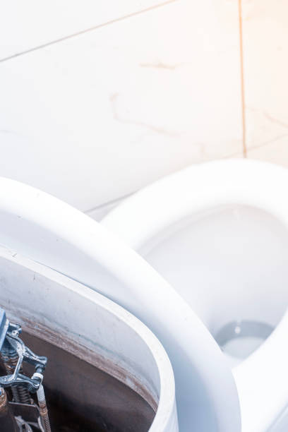 istock open toilet cistern when flush system breaks down, dirty poorly paid plumbing job 1474402551