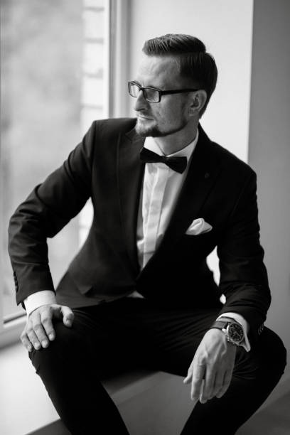 istock groom in a black suit with a bow 1474402803
