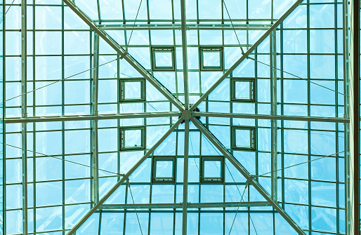 Transparent glass roof with steel frame.