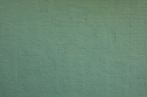 Green textured wall background with copy space