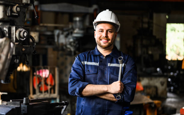istock Smiling portrait of mechanical technician checking and inspecting machine 1474405221
